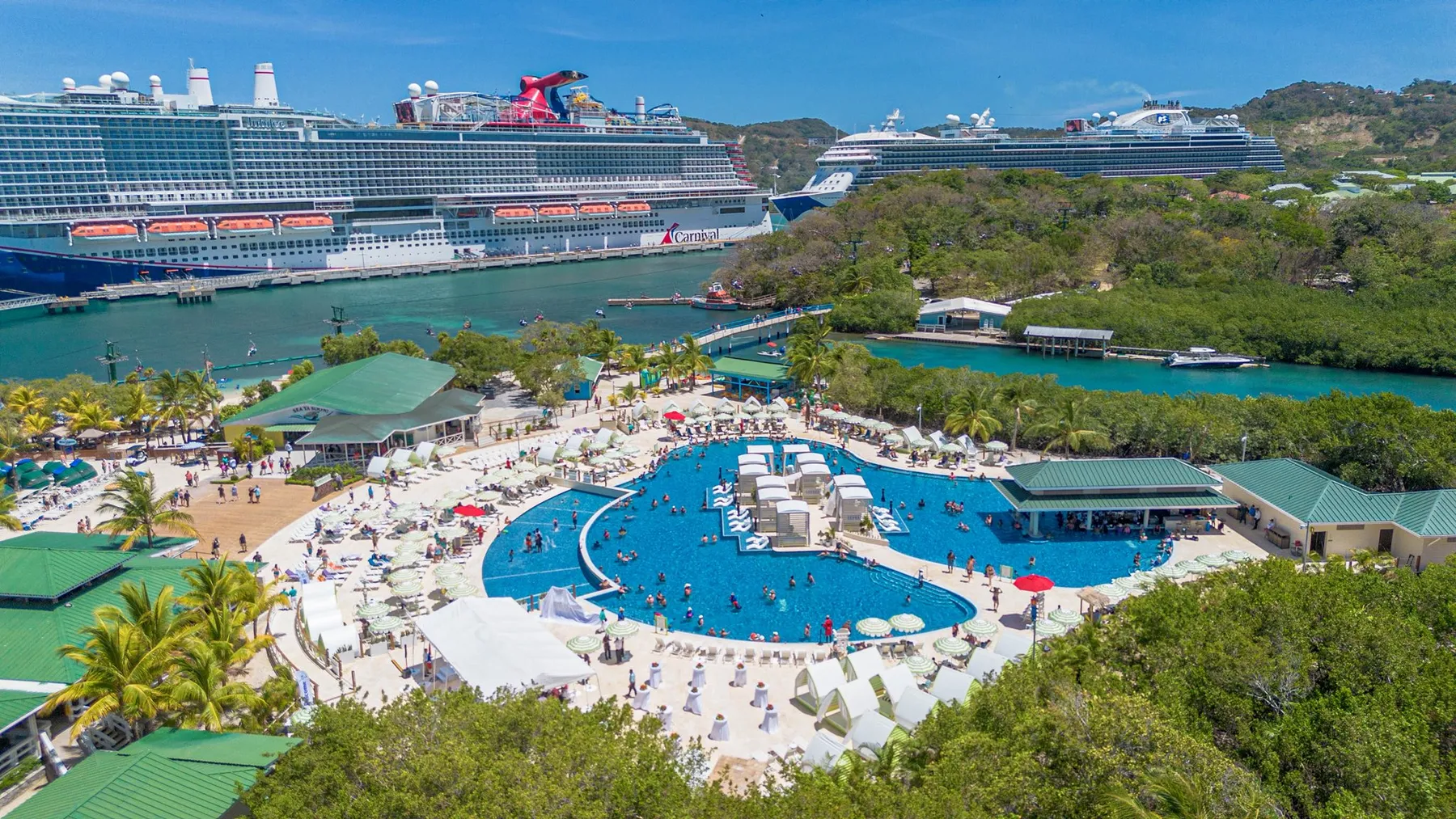 Aerial of Isla Tropicale cruise port with two cruise ships docked in Roatan