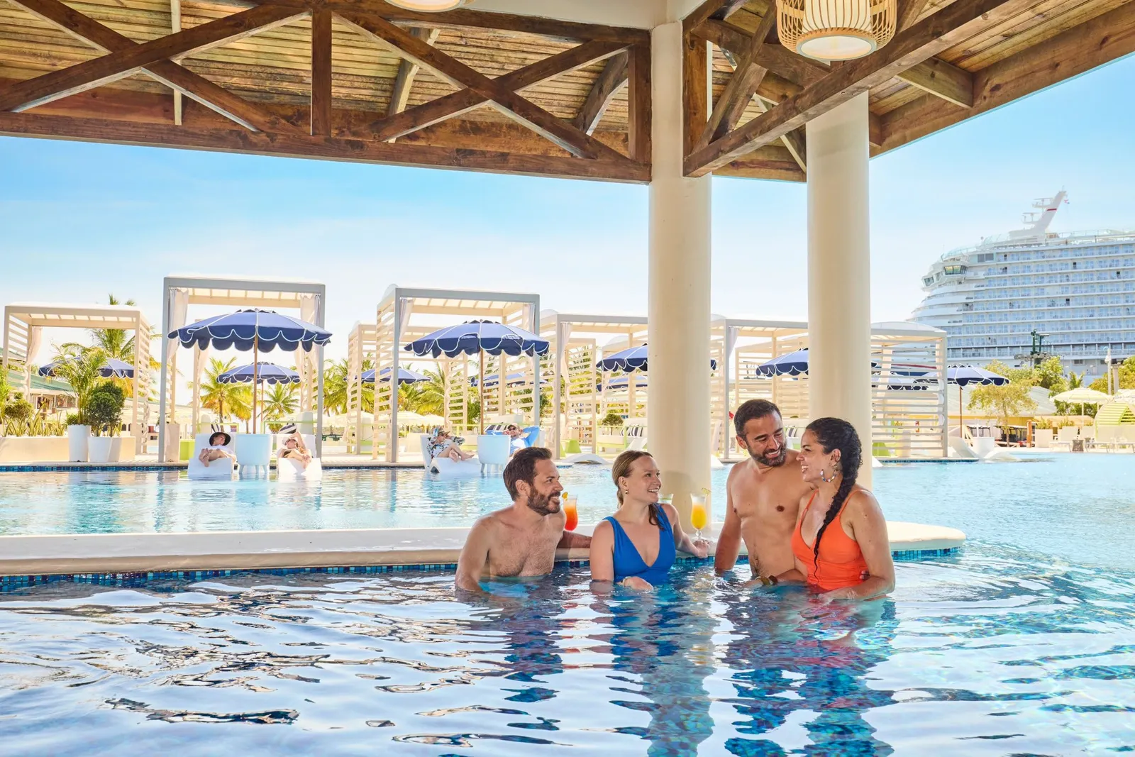 Guests at the swim-up bar in the Mangrove Bay pool, Isla Tropicale Roatan